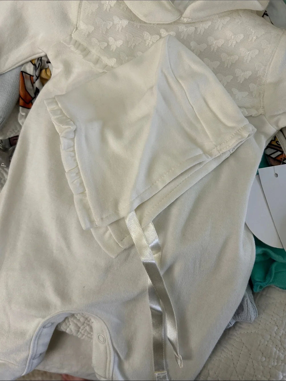 Edgehill Collection Ivory Footed Baby One-Piece with bow detail. NB